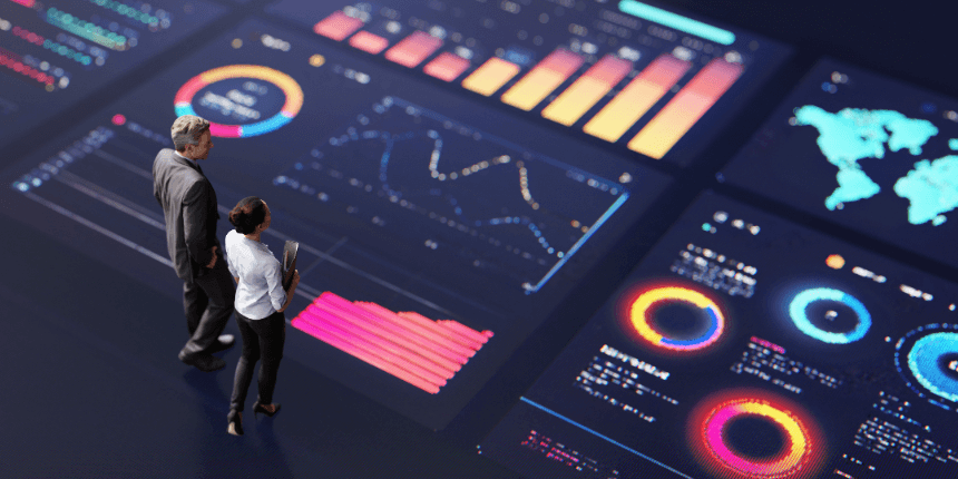 Two professionals reviewing a futuristic analytics dashboard with colorful charts, graphs, and data visualizations, representing data-driven decision-making and performance insights.