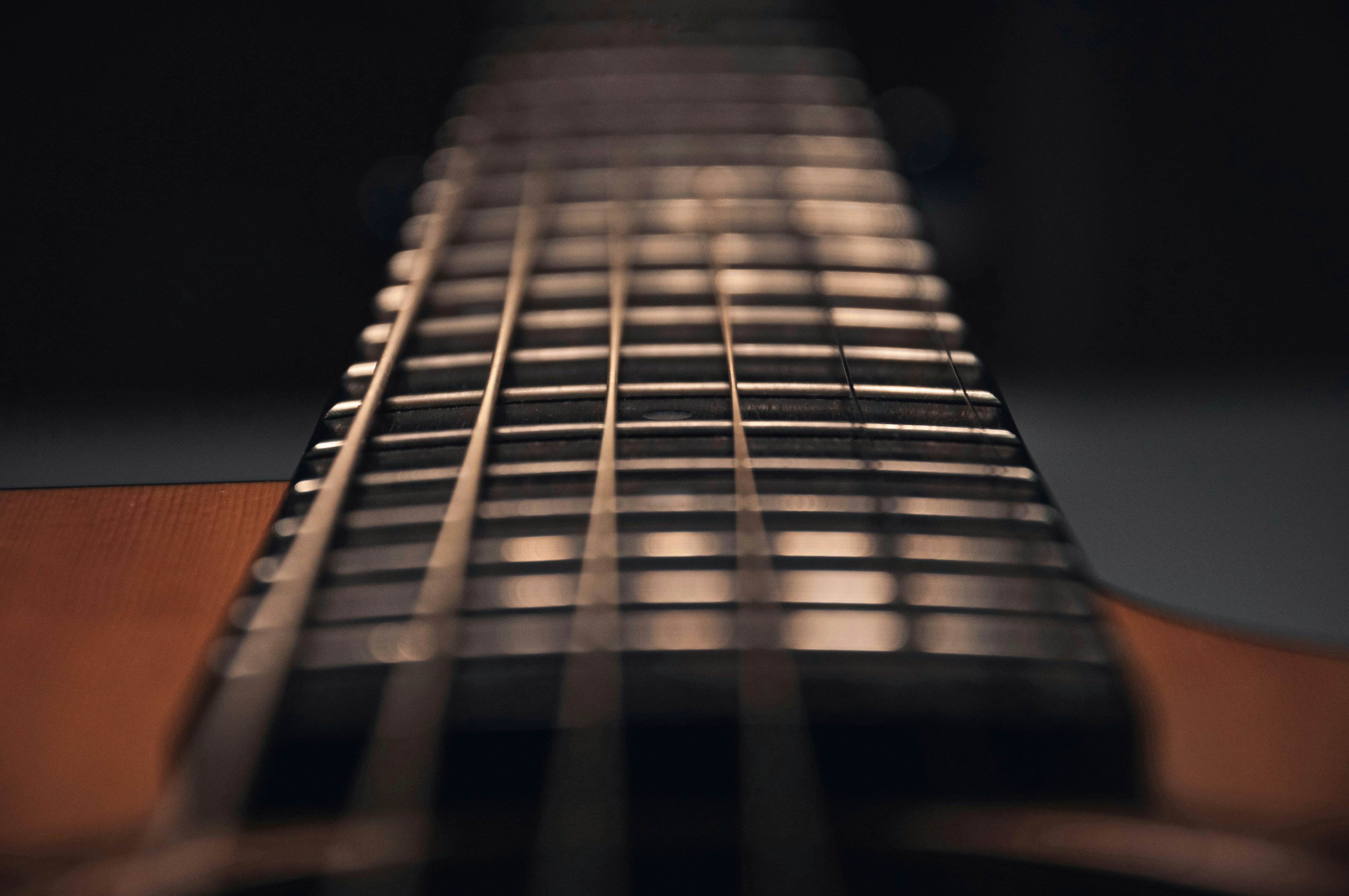 Man fretting a guitar