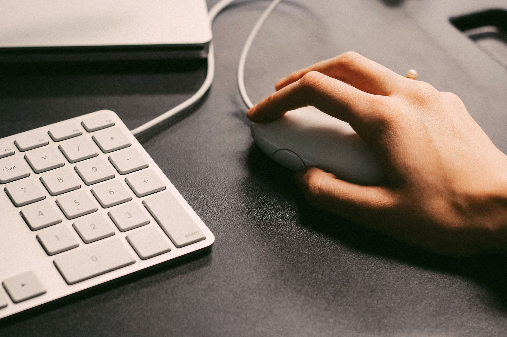 a hand using a computer mouse.