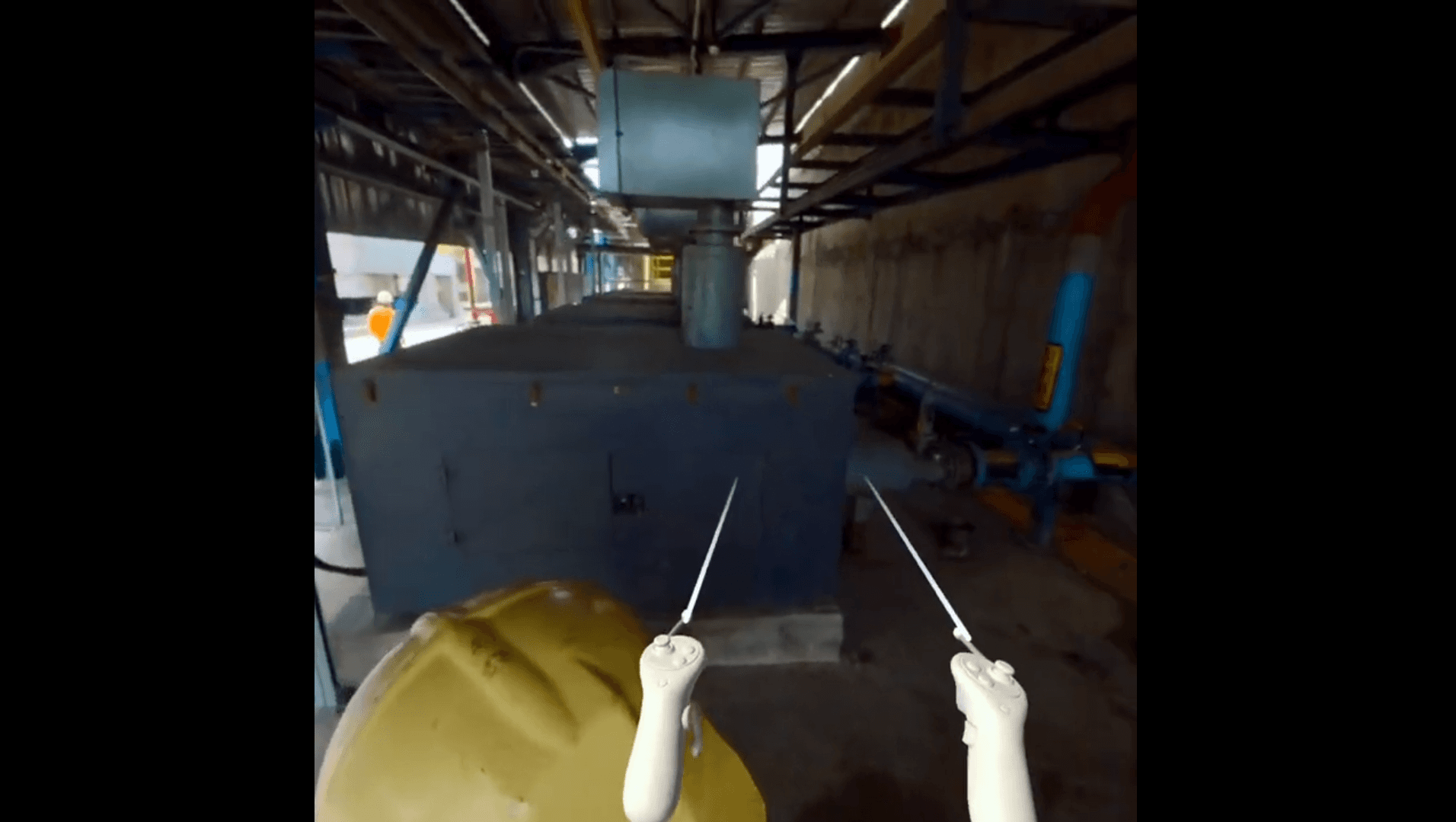 man in black jacket holding blue and white plastic cup
