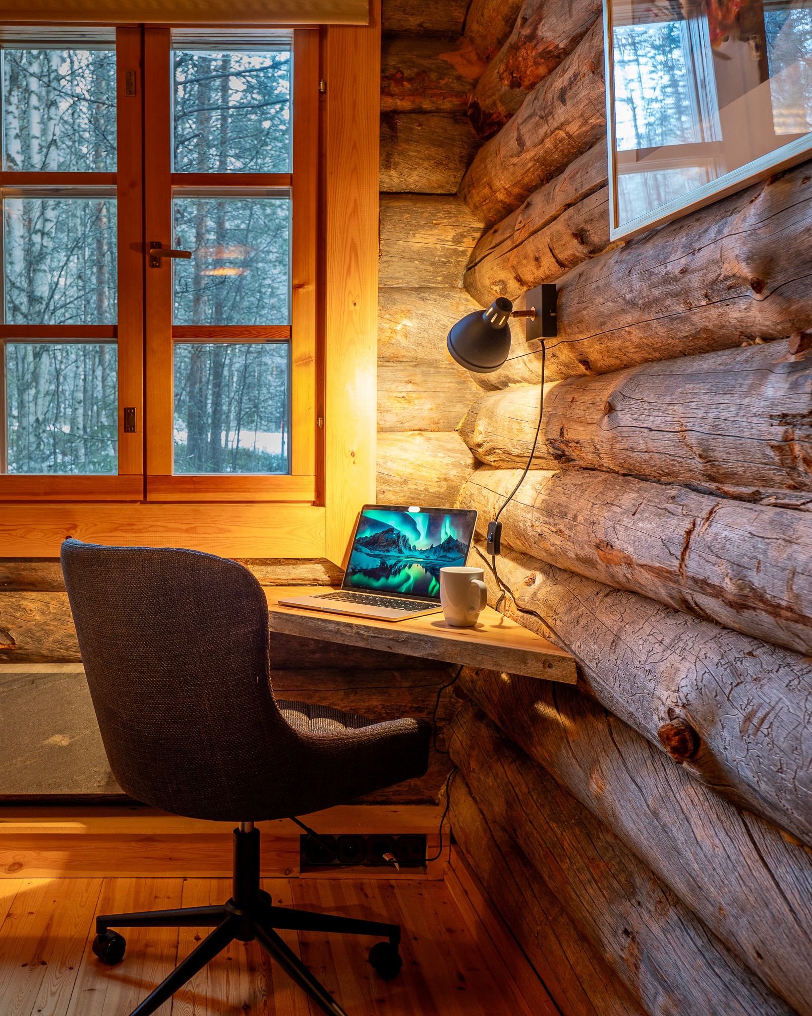 two ladies looking at a laptop and smiling
