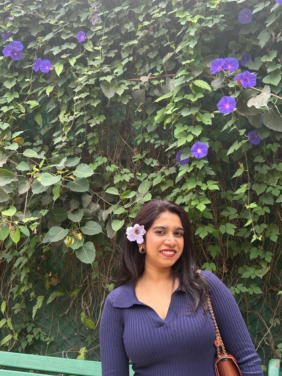 woman standing near blue steel gate
