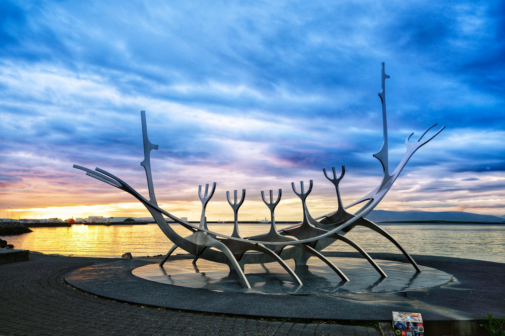 Sun Voyager sculpture on the Reykjavik waterfront at sunset with Faxafloi Bay in Iceland.