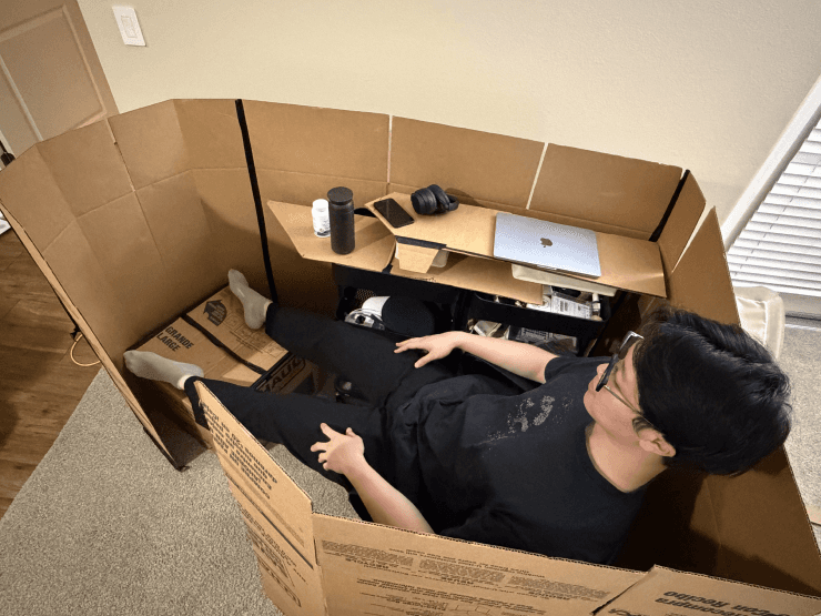 ONTRA occupied cardboard mock-up with personal belongings