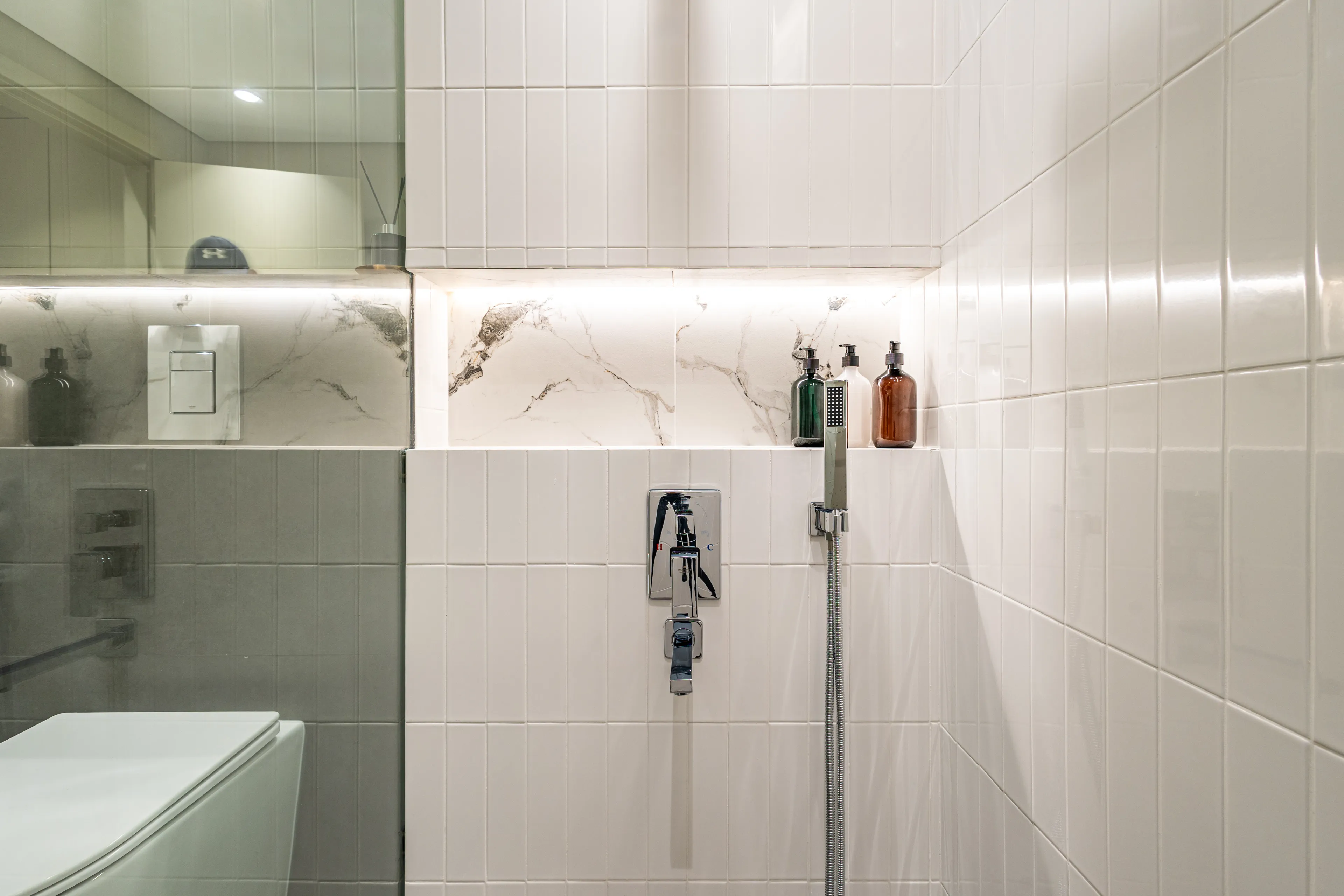 A horizontal image of a minimalistic bathroom's detail.