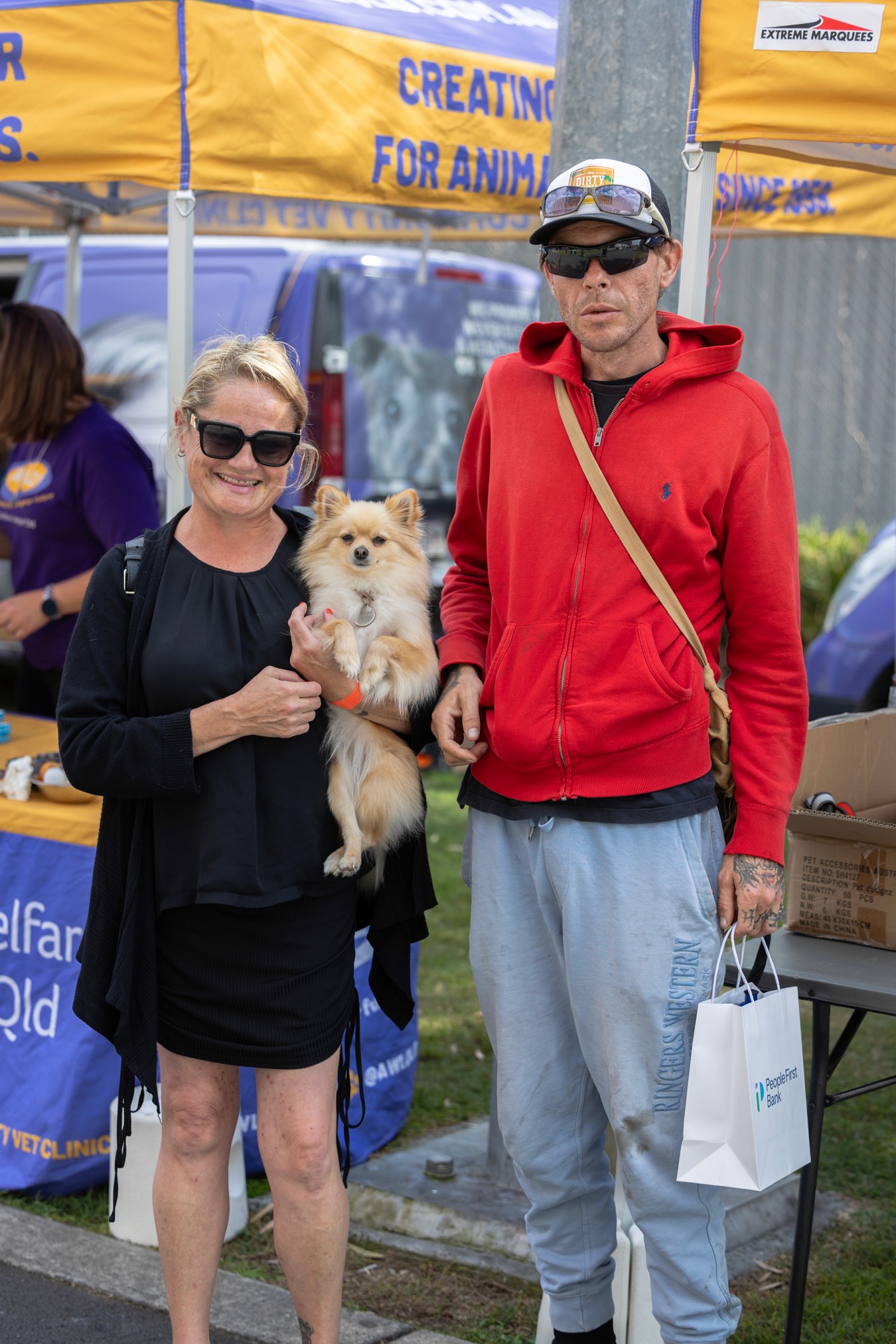 Man and woman holding pomeranian