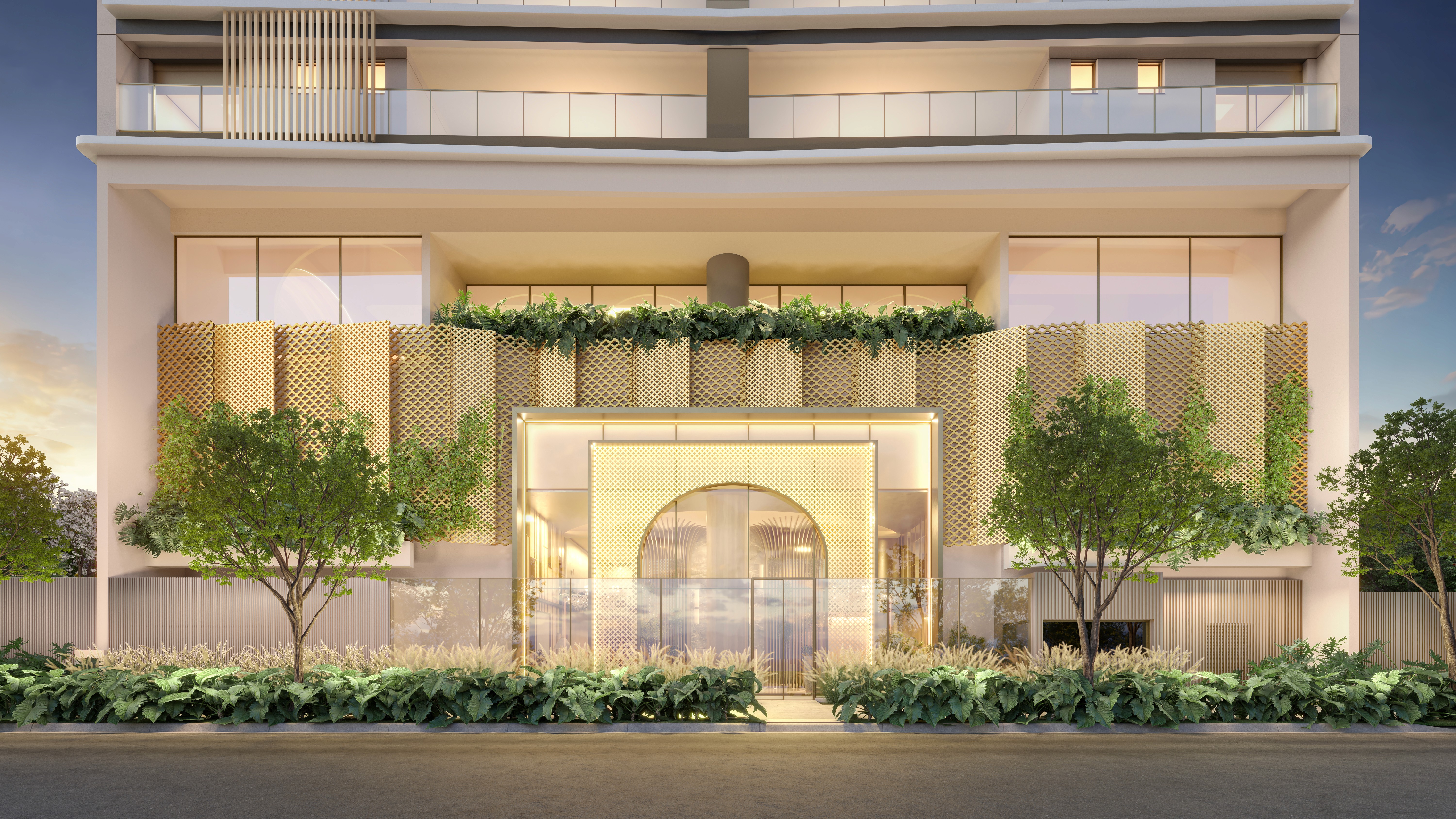 Curved modern skyscraper against a clear blue sky.