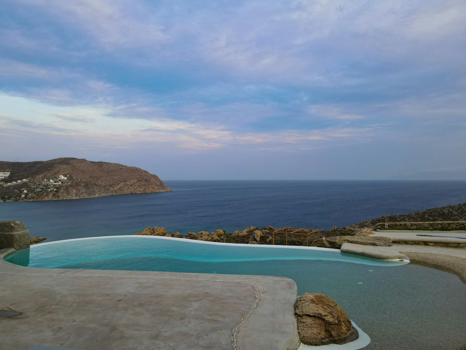 Infinity pool terrace of a villa above the Aegean Sea on Mykonos, Greece