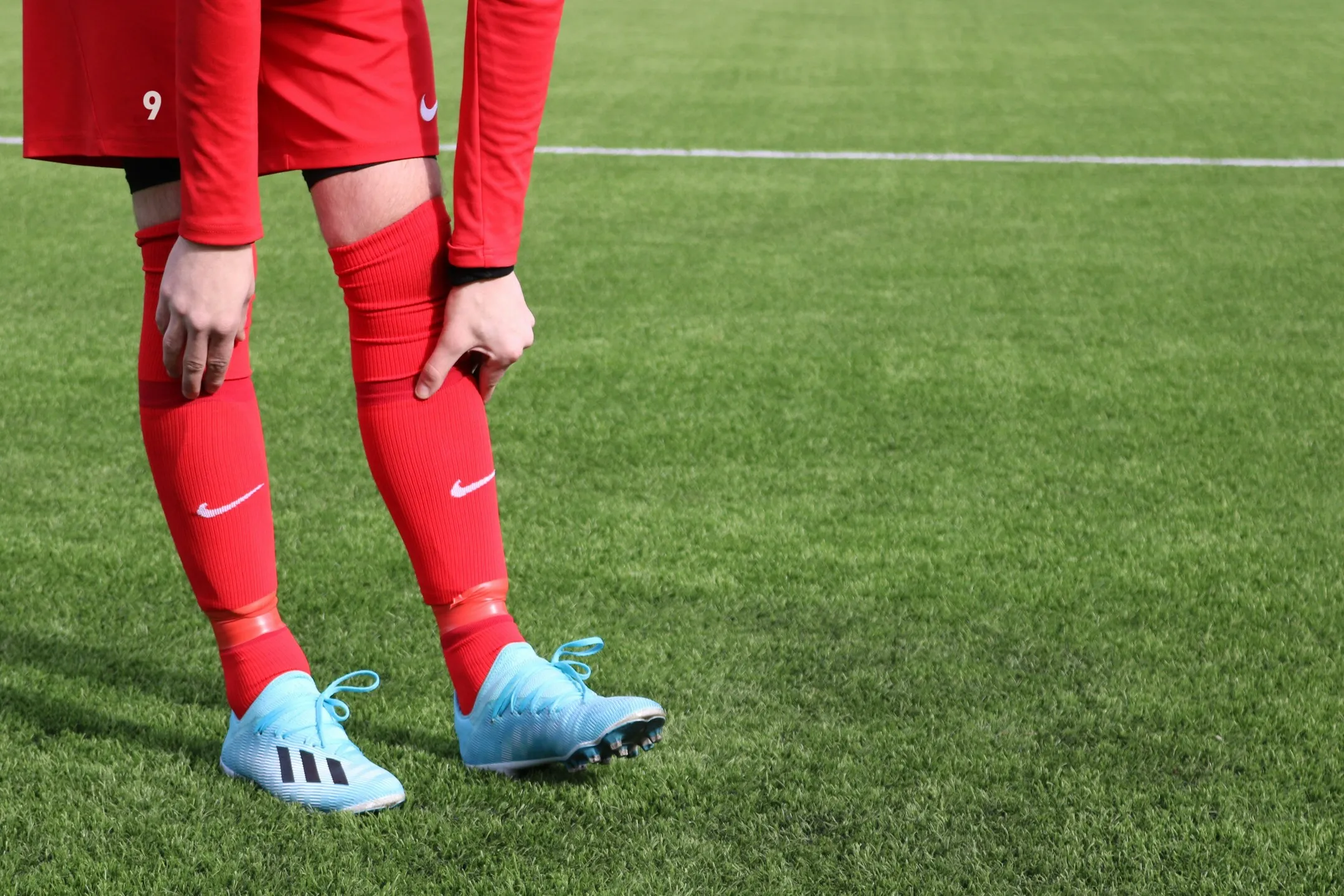 why footballers wear short socks, why soccer players cut socks, football short socks trend, grip socks football, football grip socks benefits, why pros wear grip socks, football socks cut at calves, soccer socks rules FIFA, short socks vs long socks football, calf compression football, football sock taping calves, football socks and blood flow, do footballers cut their socks, football sock comfort, grip socks vs team socks, football socks injury prevention, why do players wear grip socks, professional football sock trend, soccer sock rules explained, football sock performance benefits