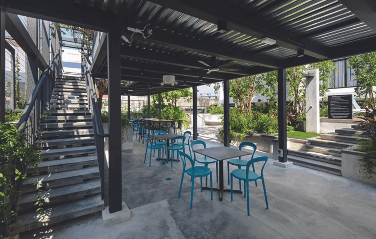 a living room with two recliners and a sink