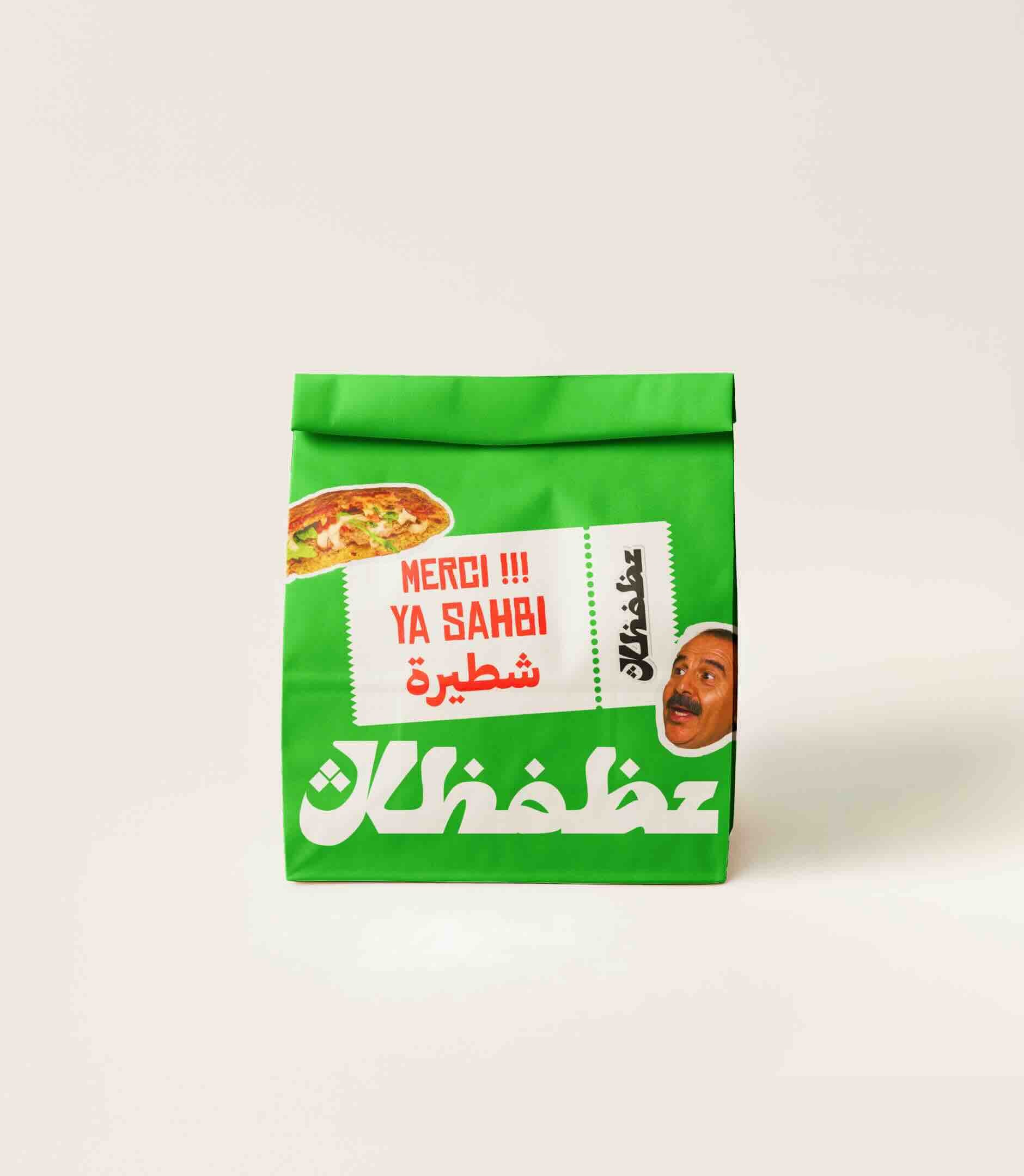 Close-up view of a beef burger with cheese and tomato