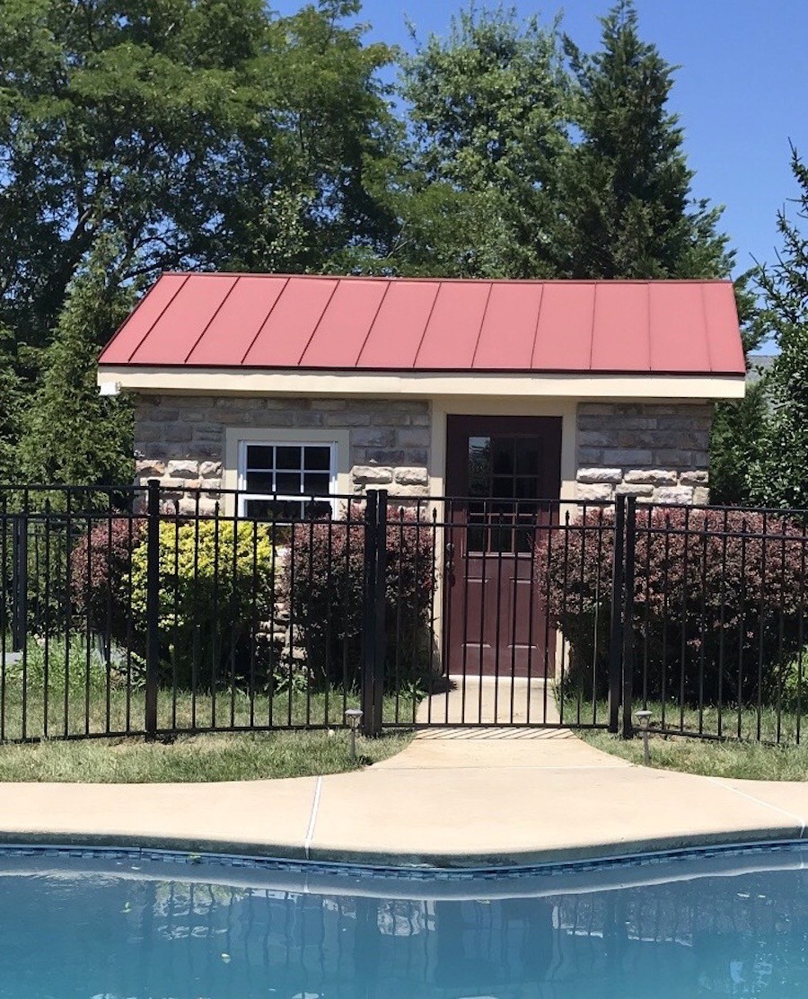 Haven Guard fence with internal spears reflecting elegantly over a residential pool.