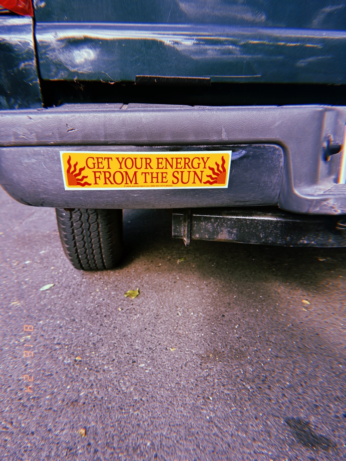 A small yellow notice on the back of a vehicle. Photograph by Pranjali Shah.