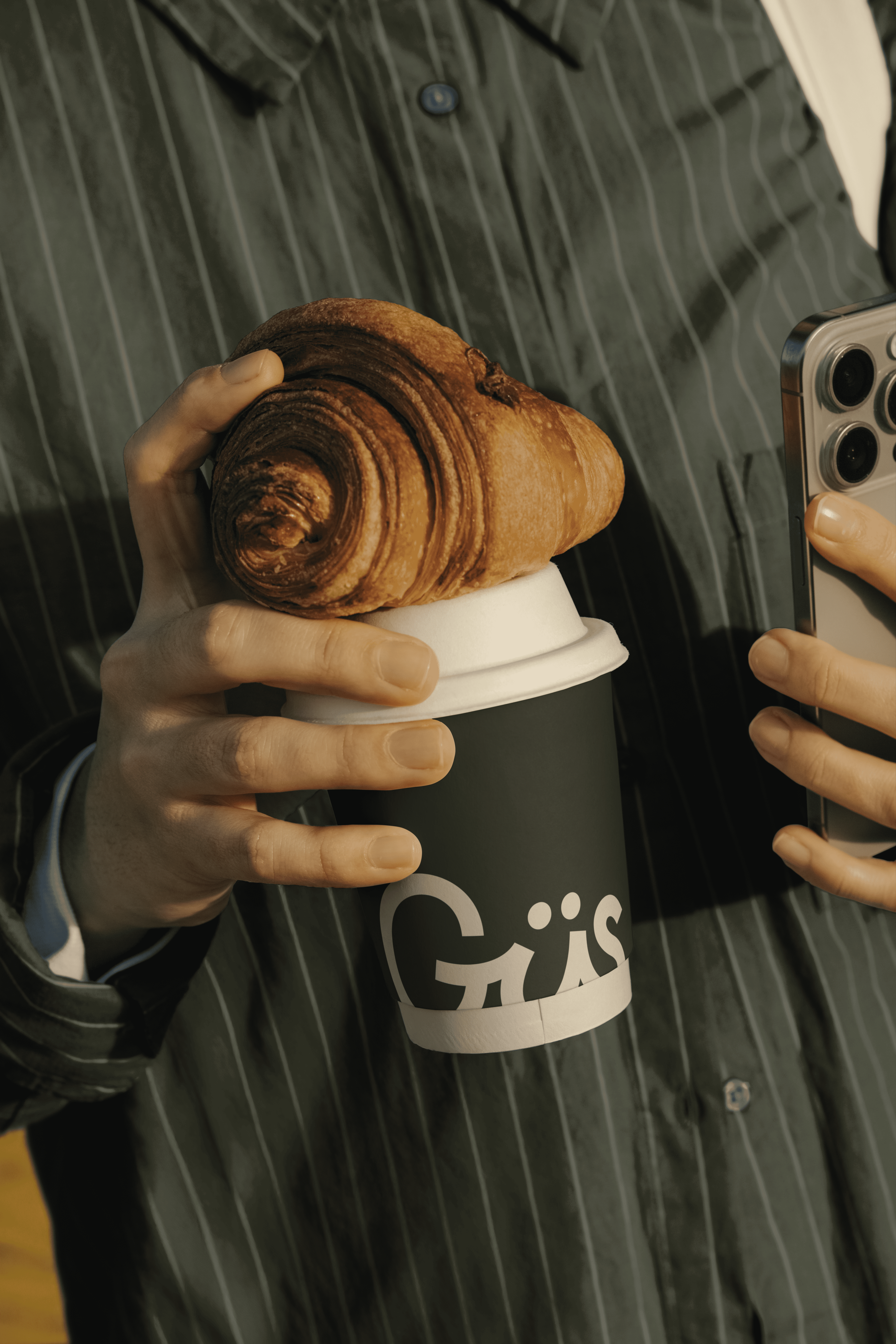 three person holding beverage cups