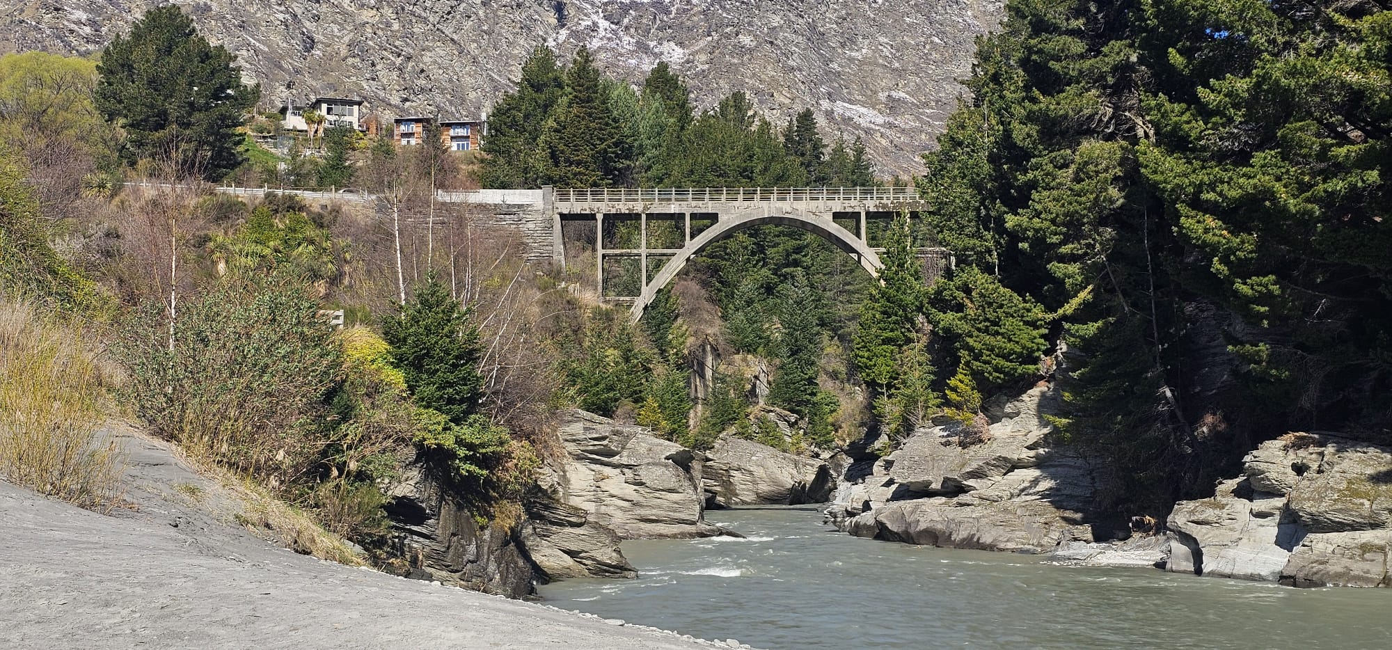 Shotover River and surrounding terrain near Edith Cavell Bridge at Arthurs Point.