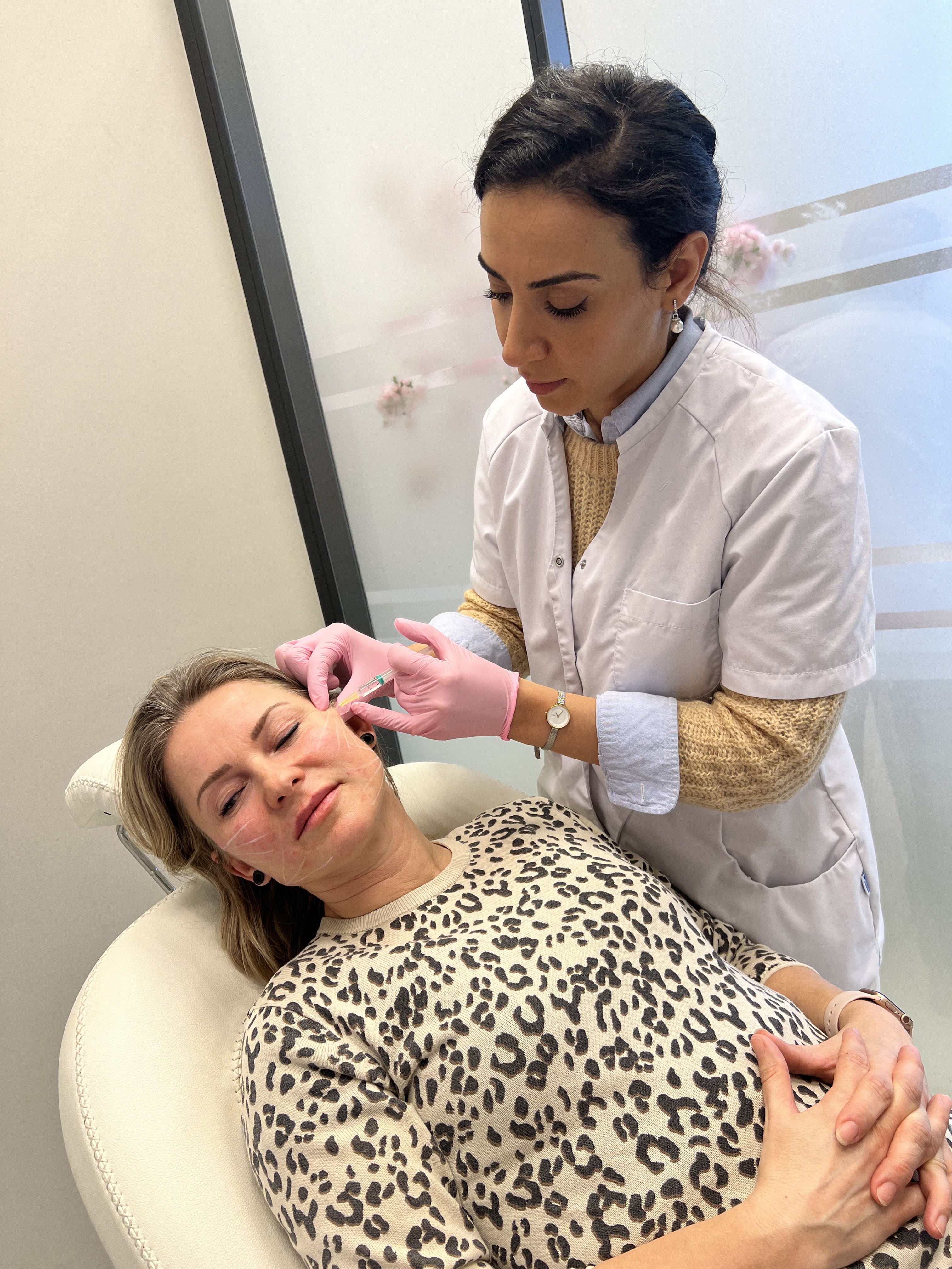 Man applying skincare product to his face