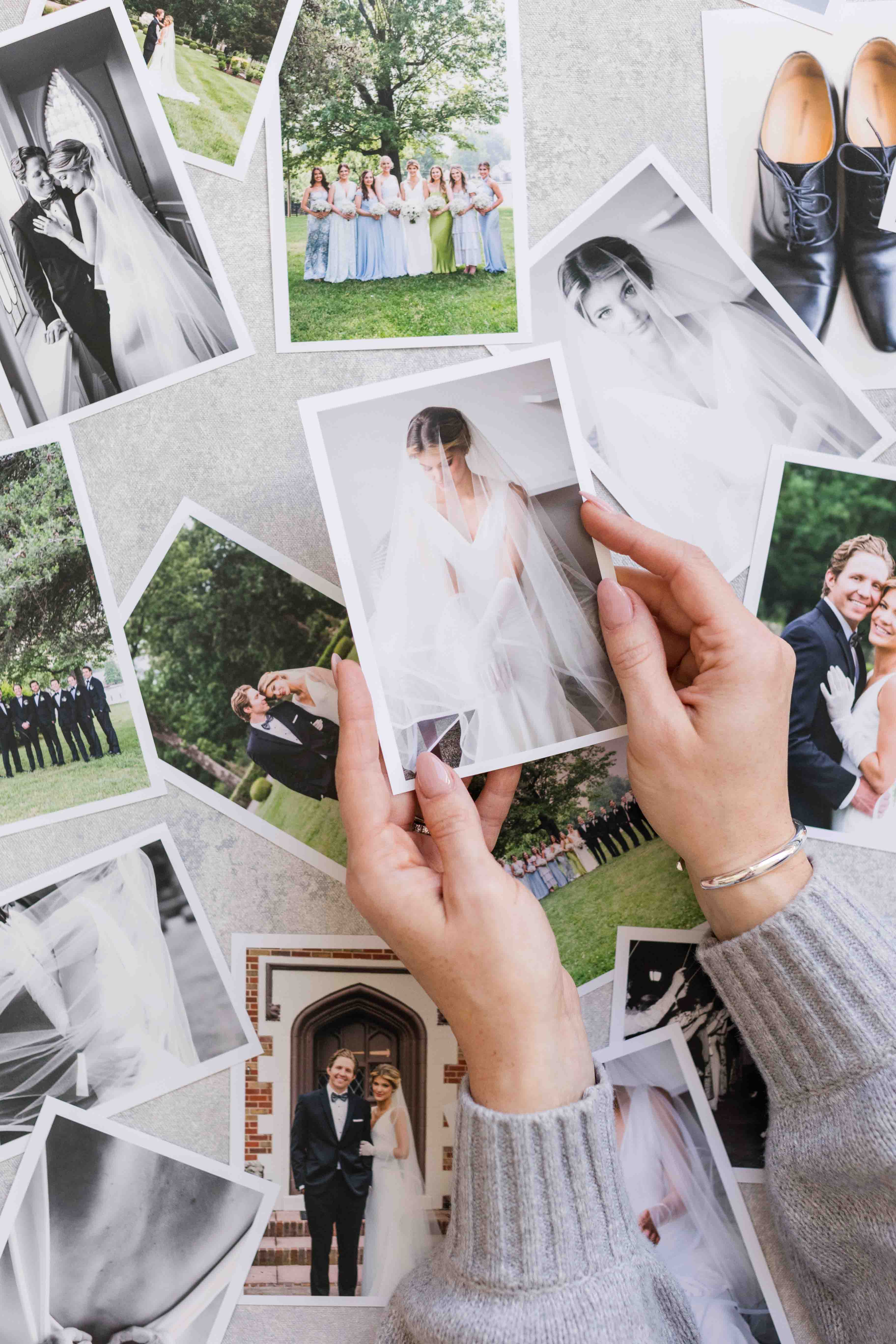 Black and white portrait of bride putting on her earring.