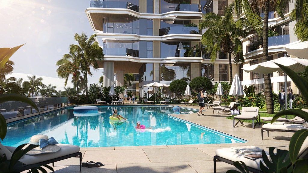 A swimming pool in front of the Edgewater Residences, showcasing a tall building in the background.
