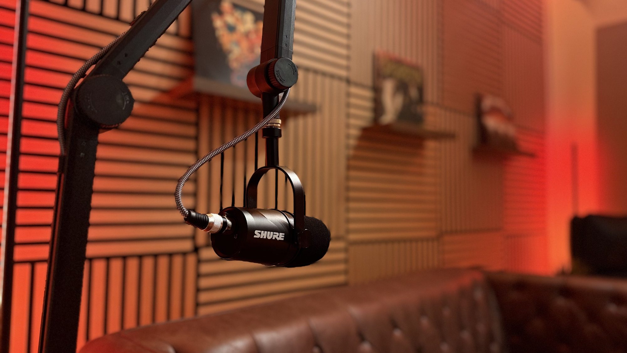 Dual microphone setup for interviews and co-hosted talk shows inside the professional podcast recording room at Red Mile Records in Calgary.