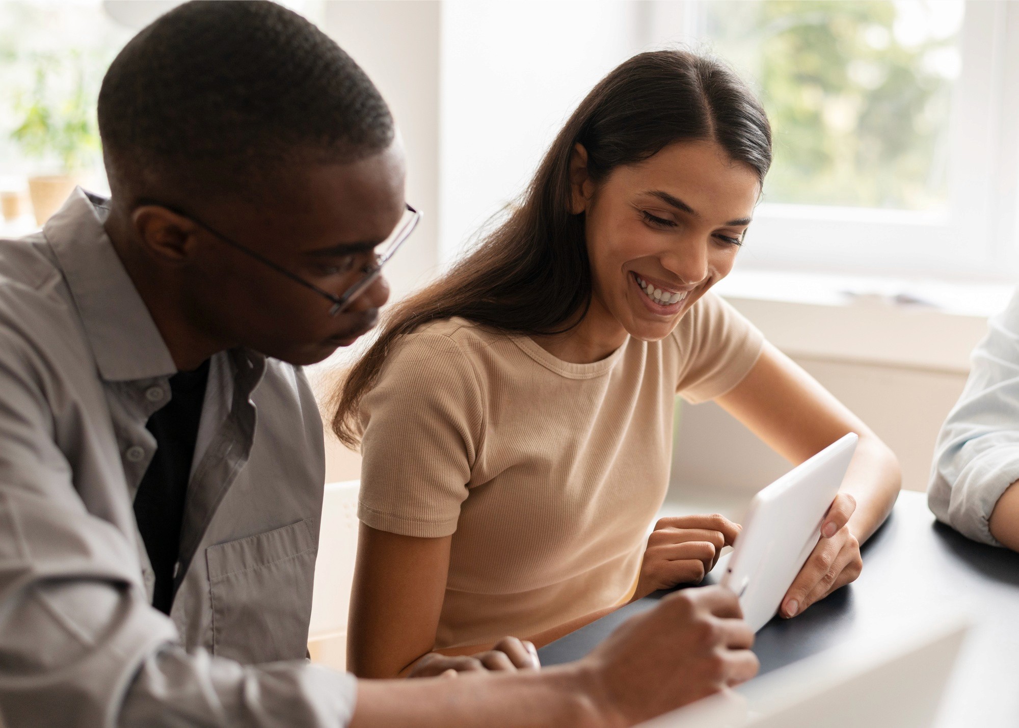 young couple looking at loan application on tablet