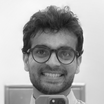 smiling woman wearing white and black pinstriped collared top