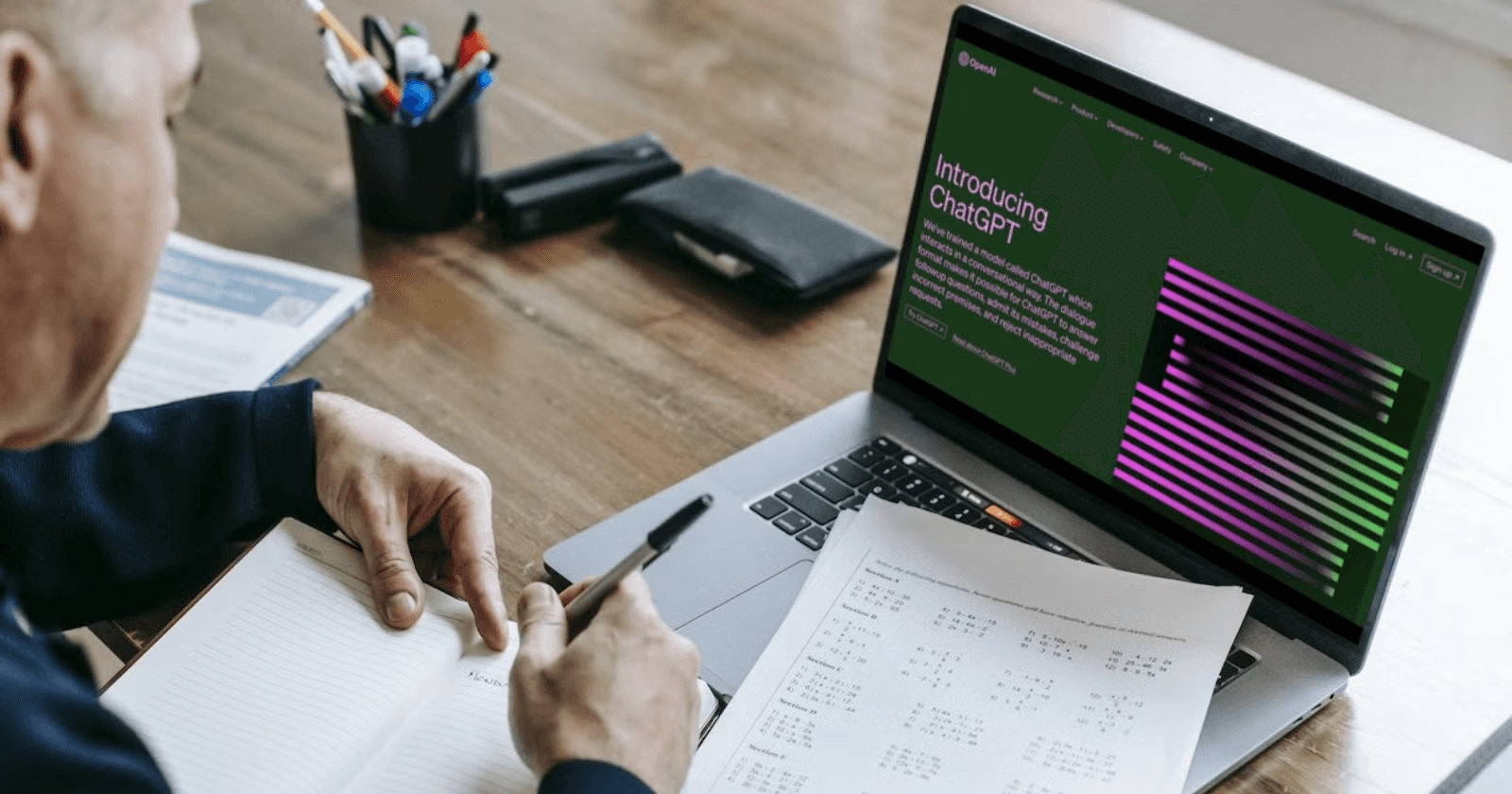 Man using laptop to study ChatGPT - Top Tools for Generating Equity Research Reports