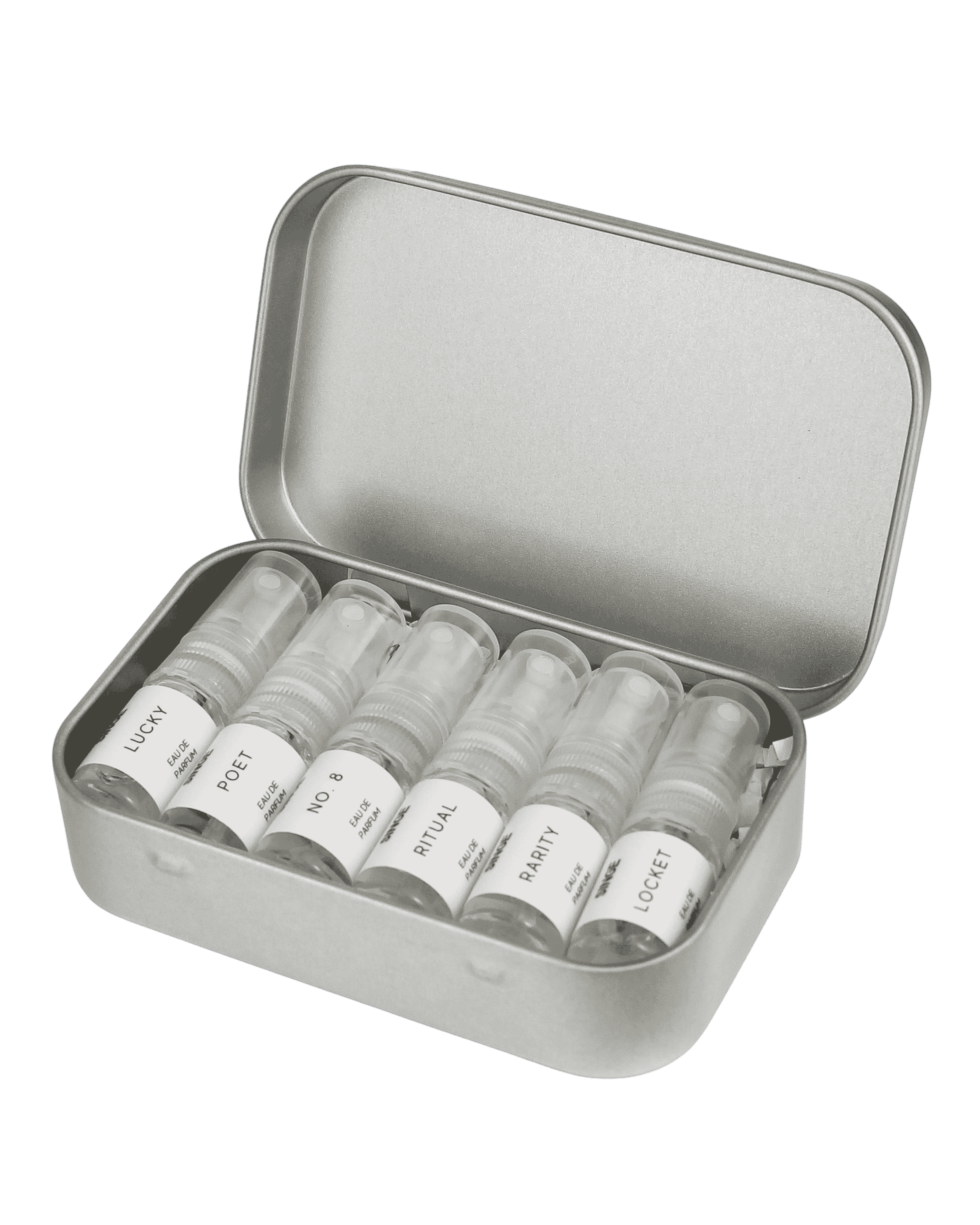 An open silver metal tin containing six small clear spray bottles with white labels.