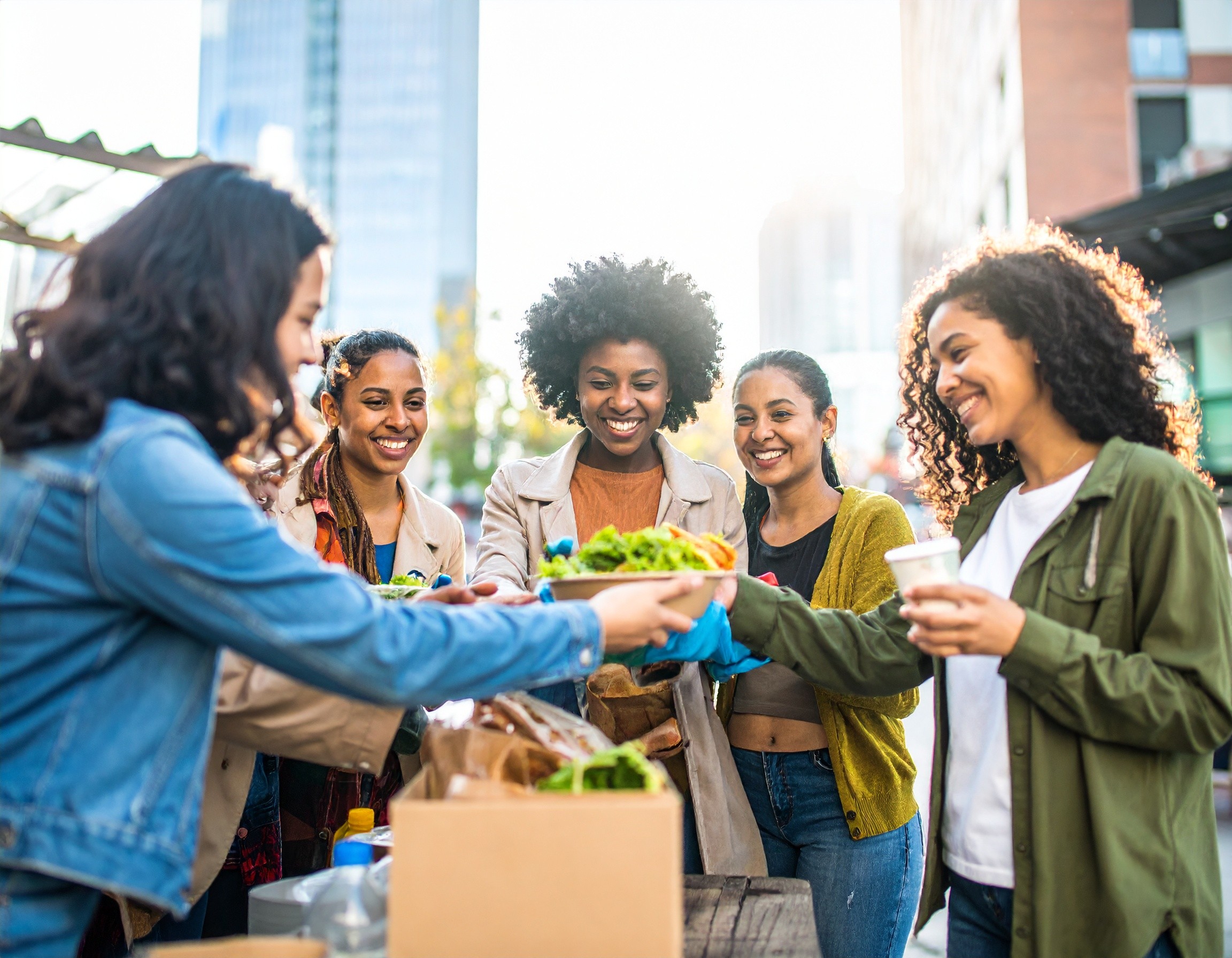 A beautifully arranged table with various dishes, including fruits, bread, and wine, set for a meal.
