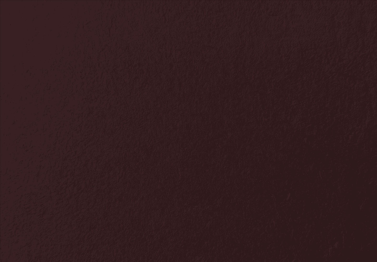 A dark background with a gradient transitioning from brown to black.