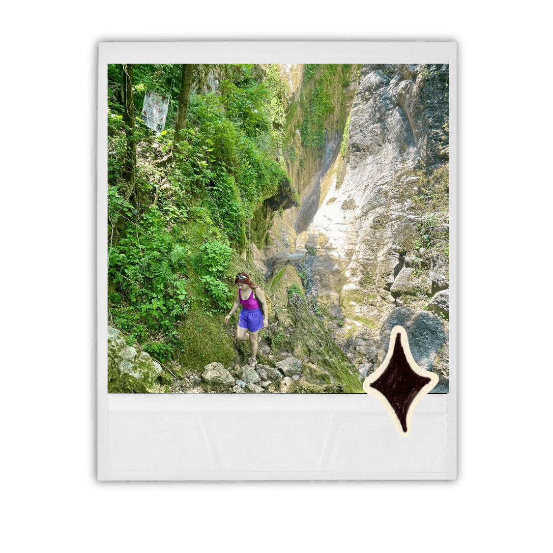 A view from an airplane window shows the aircraft's wing with a golden hue reflecting the setting sun, against a serene backdrop of fluffy clouds and a clear sky.