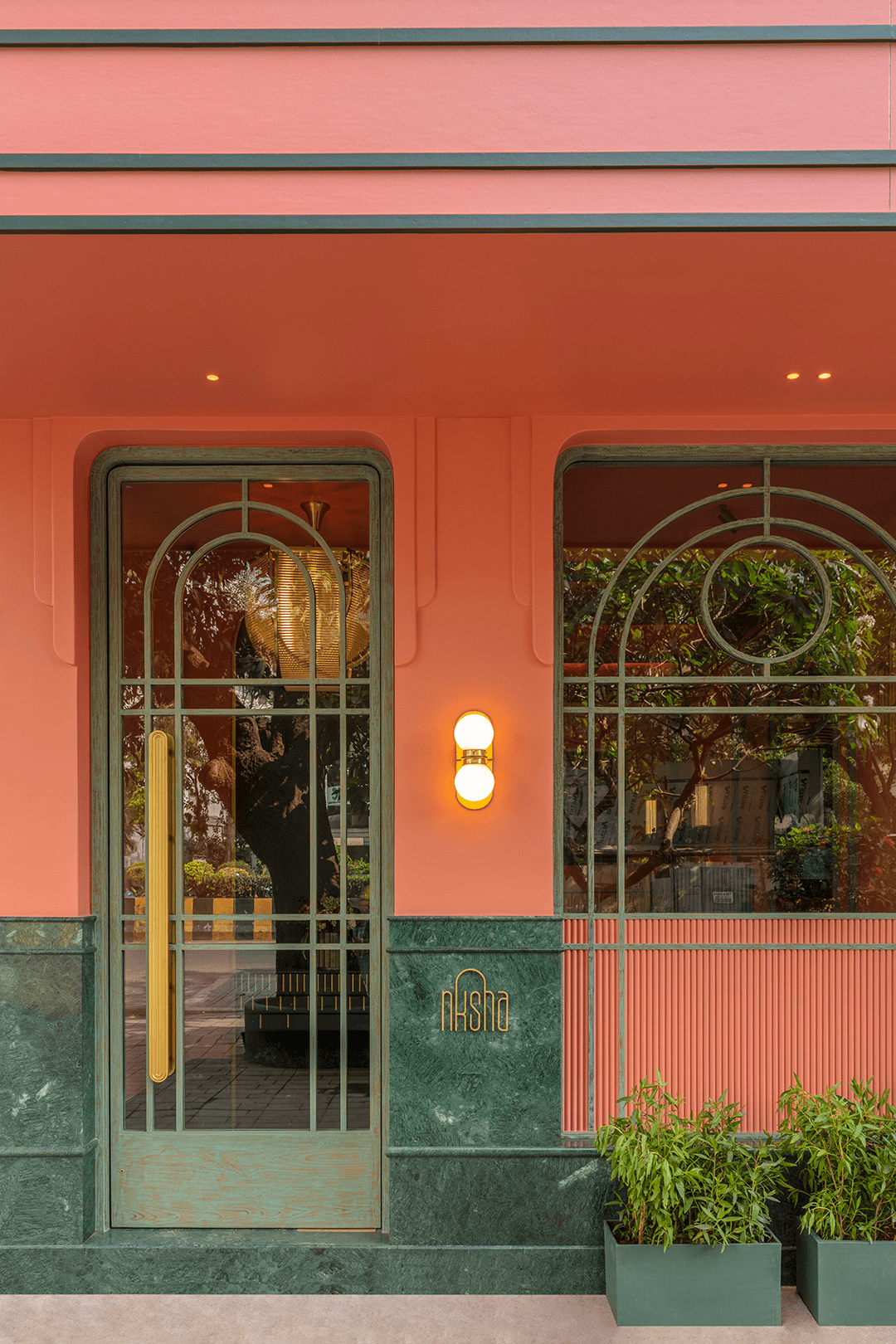 Restaurant exterior with black facade and welcoming atmosphere.