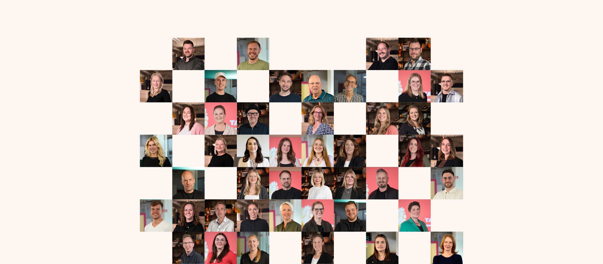 Collaborative work session overhead view of six people collaborating at a rustic wooden table with coffee, papers, and a laptop