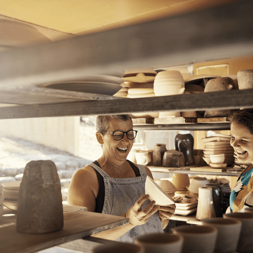 image of mother and adult daughter in ceramics studio
