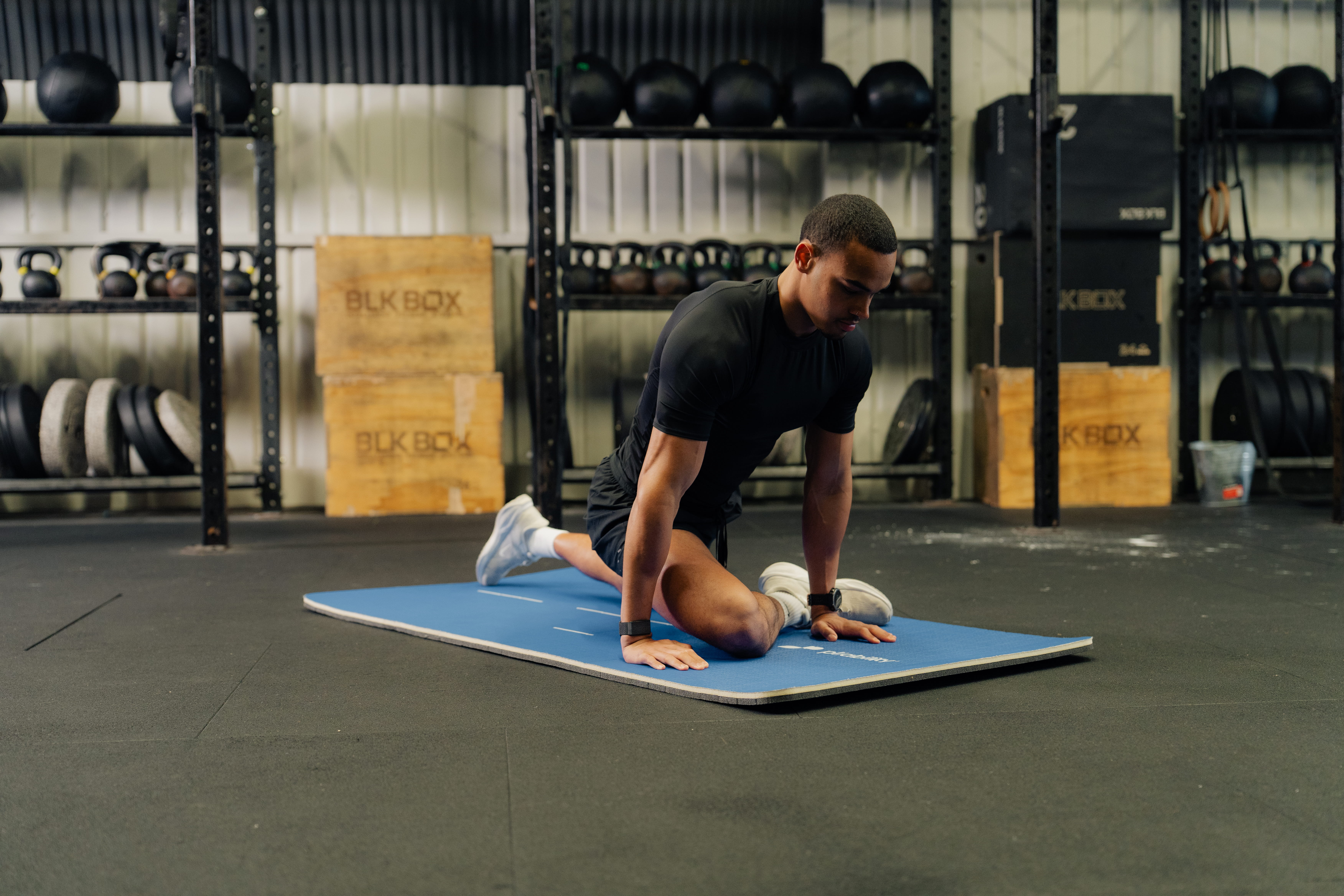 man on gym mat - How to Get Rid of Neck Stiffness 