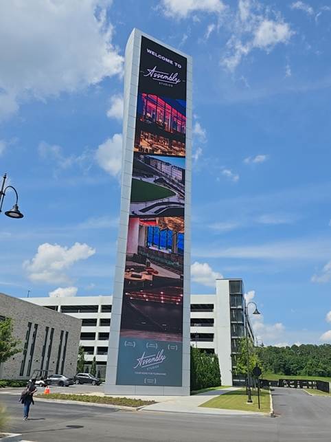 A photo of the giant screen at Assembly Atlanta, taken from the ground