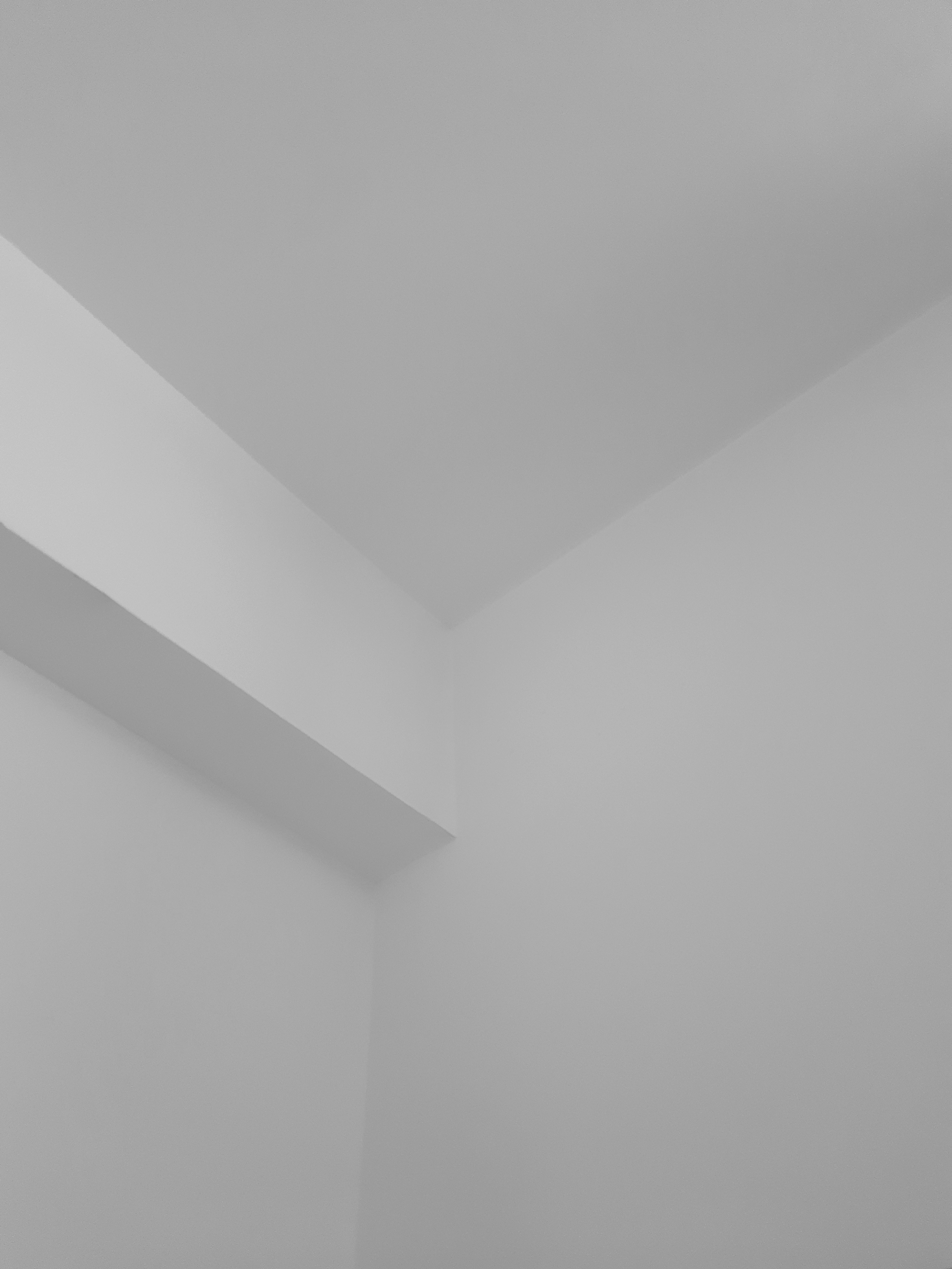 a black and white photo of a corner of a room