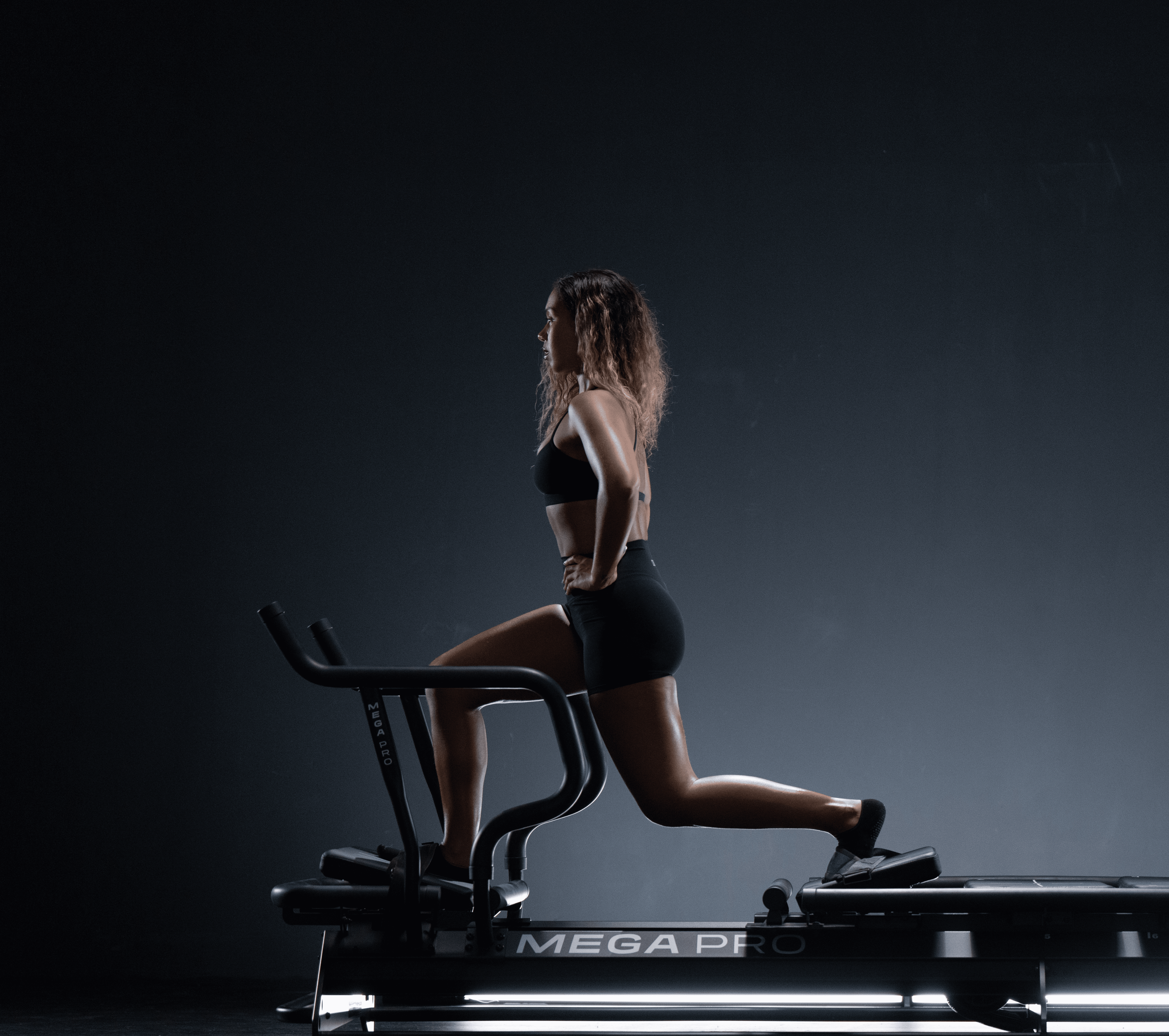 a woman is doing a piyoma exercise in a gym