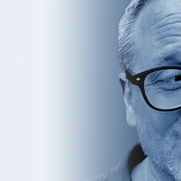 Grayscale close-up portrait of Jeremy J. McLean, Senior UX, Visual, and Motion Designer, featured in hero banner with gradient blue background.