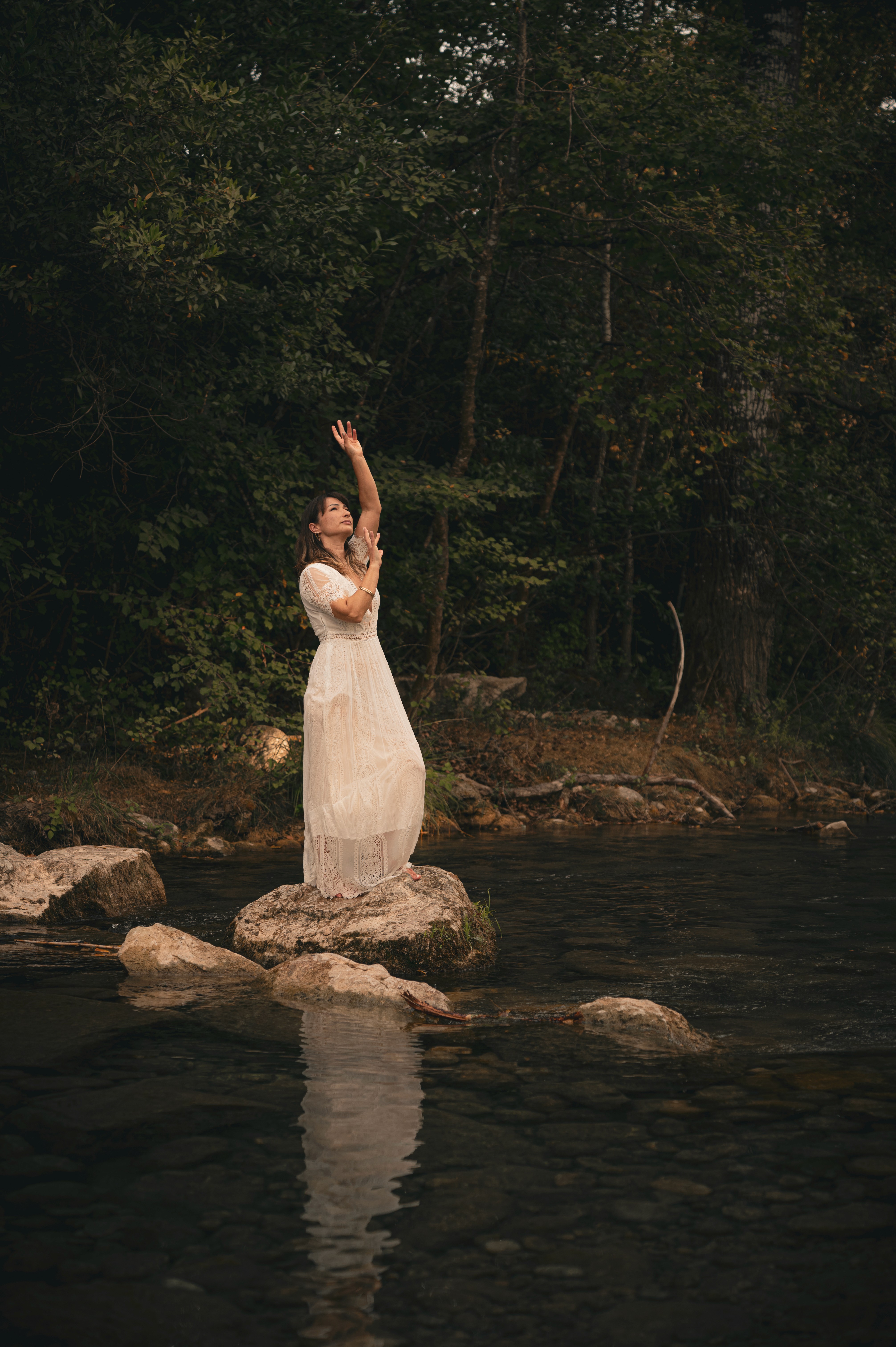 Marjorie in the middle of a river - talking to the sky