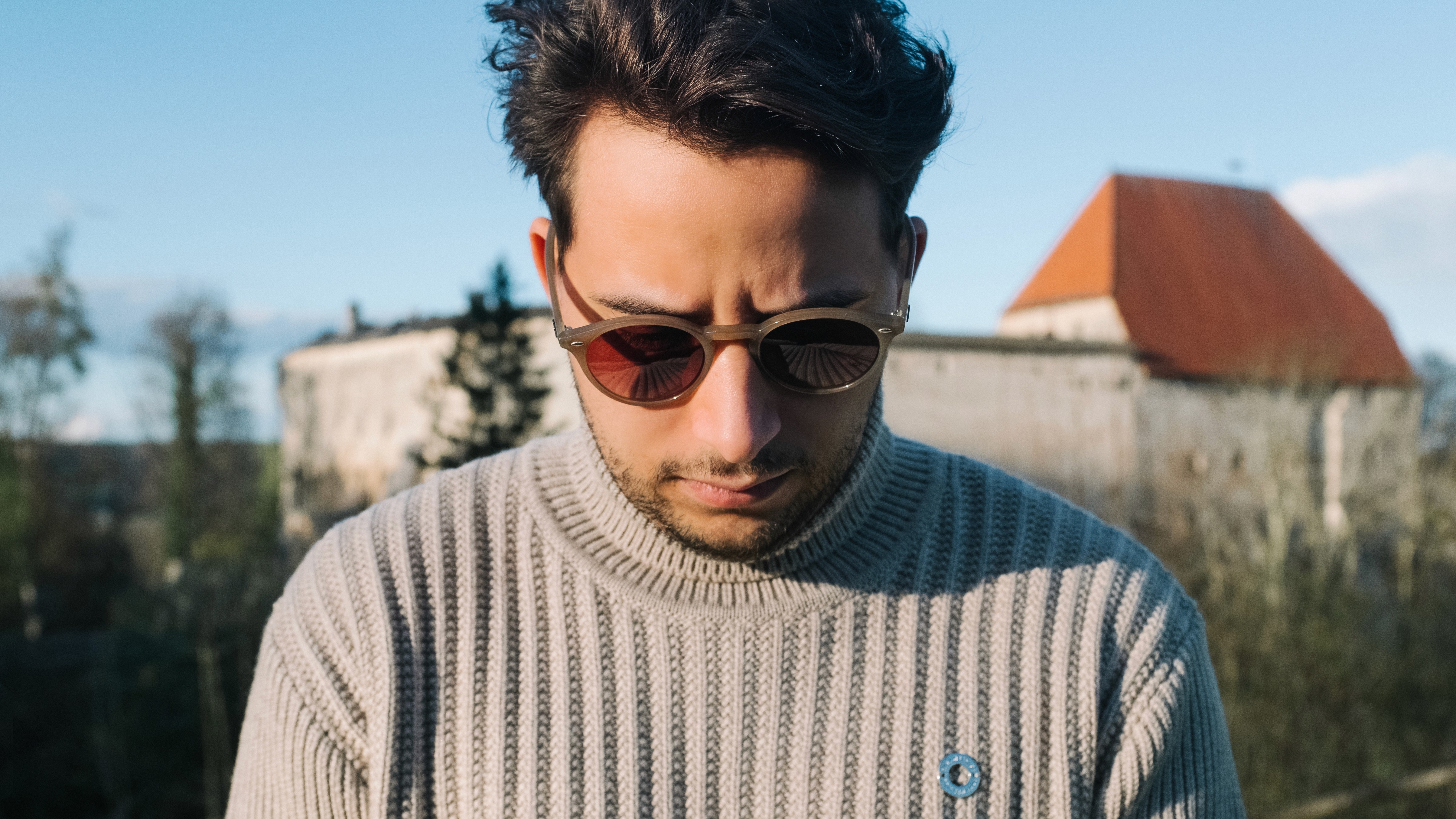 Oceanfront modern house on rocky cliff at dusk, Tidewatch Retreat