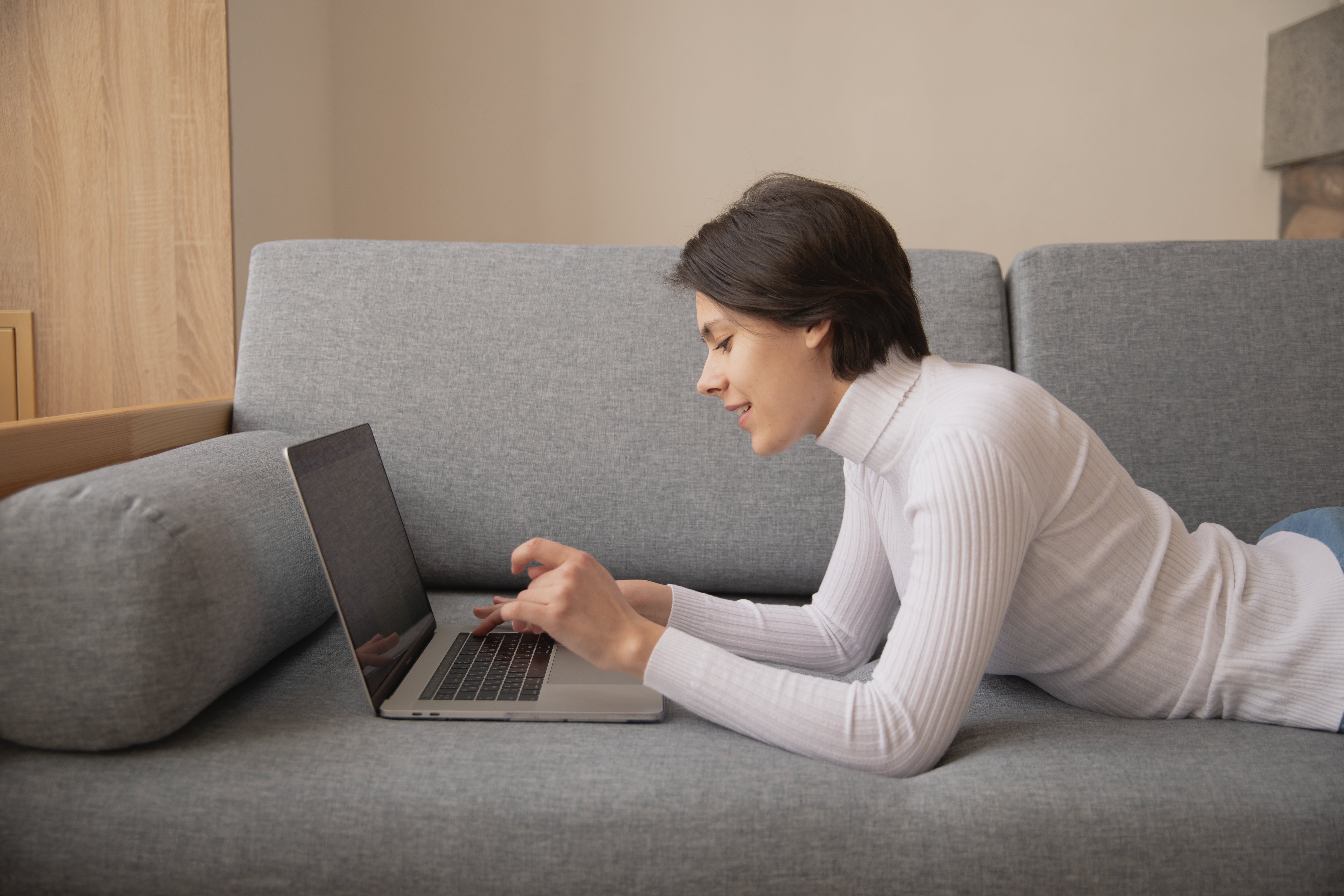 Woman using laptop searching how to become mortgage broker