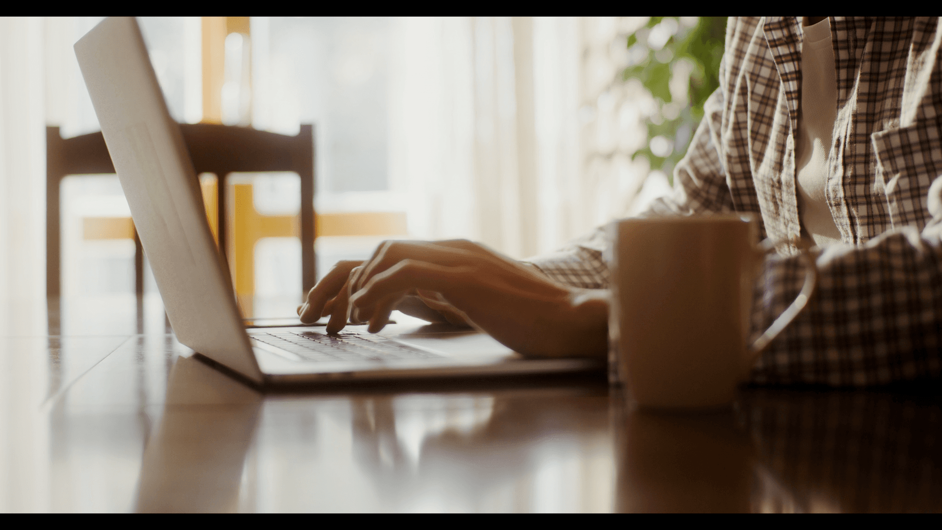 A person working on their laptop.