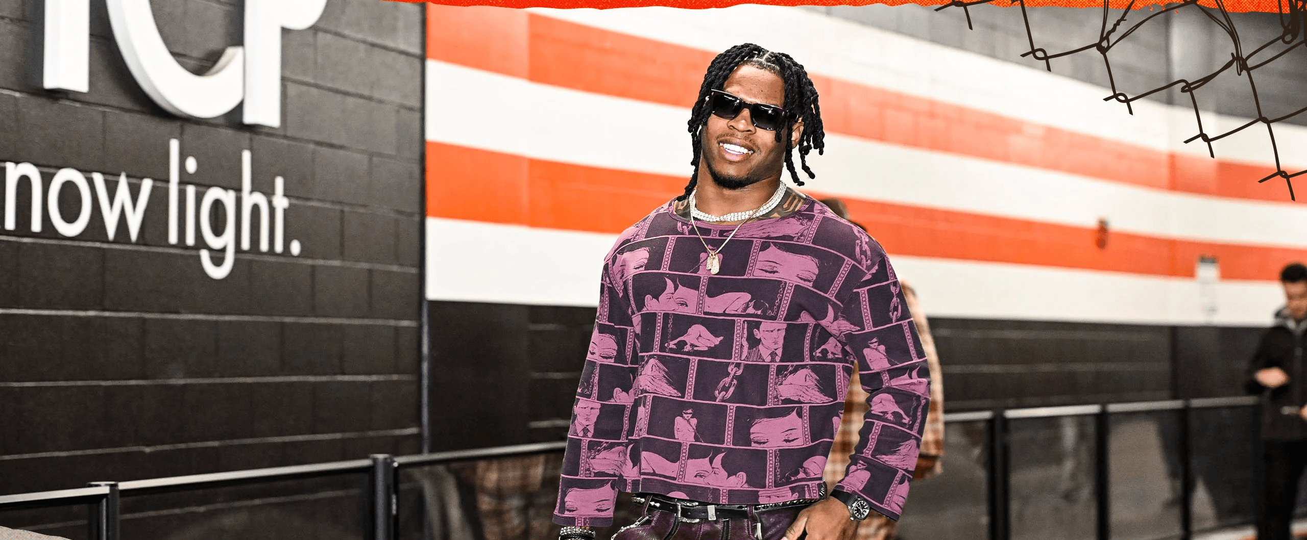 man in black suit jacket holding white ceramic mug