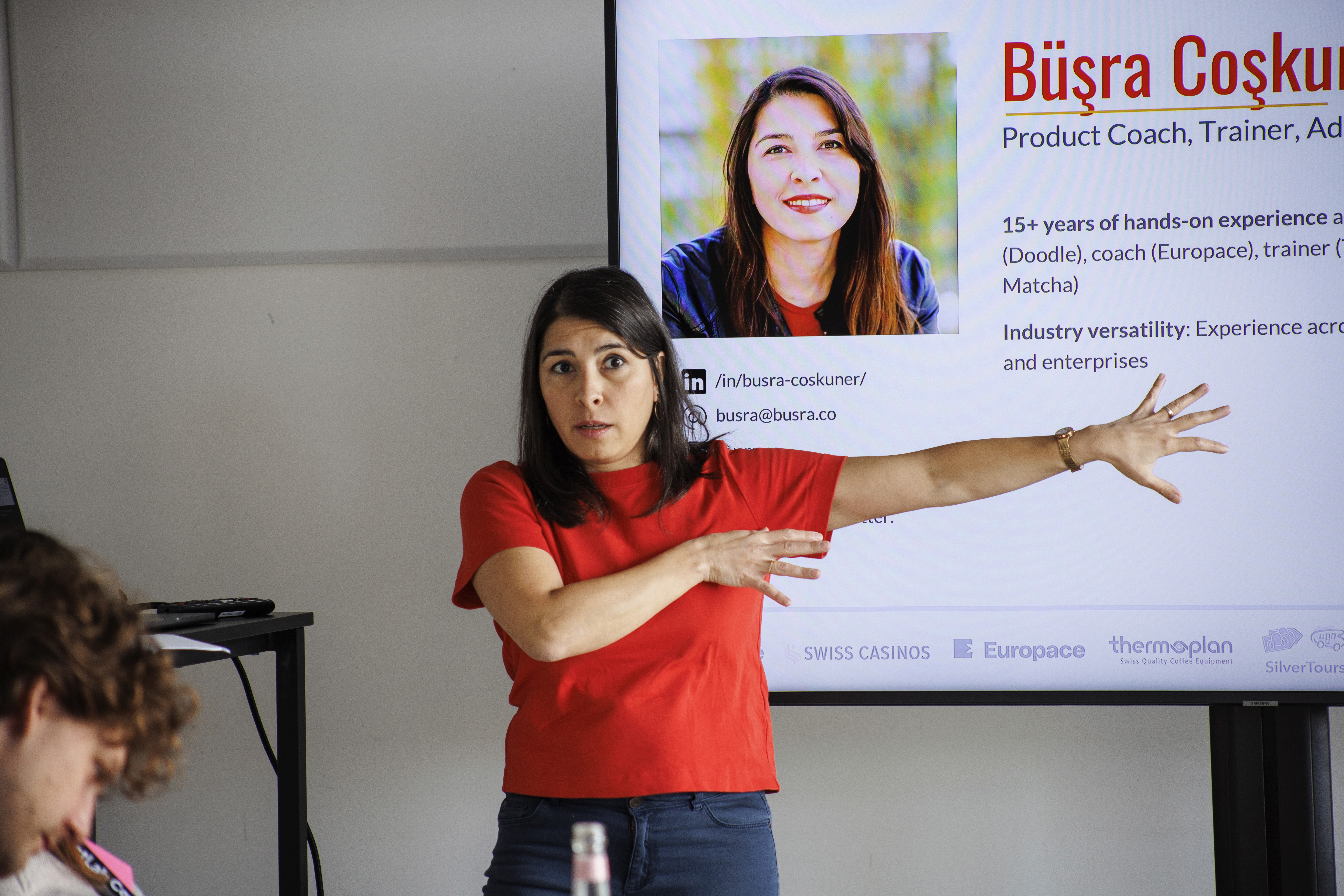 person sitting on grass and using phone