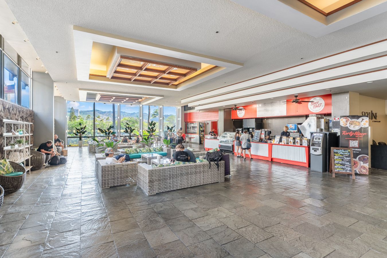 Island Colony lobby with seating area and café counter