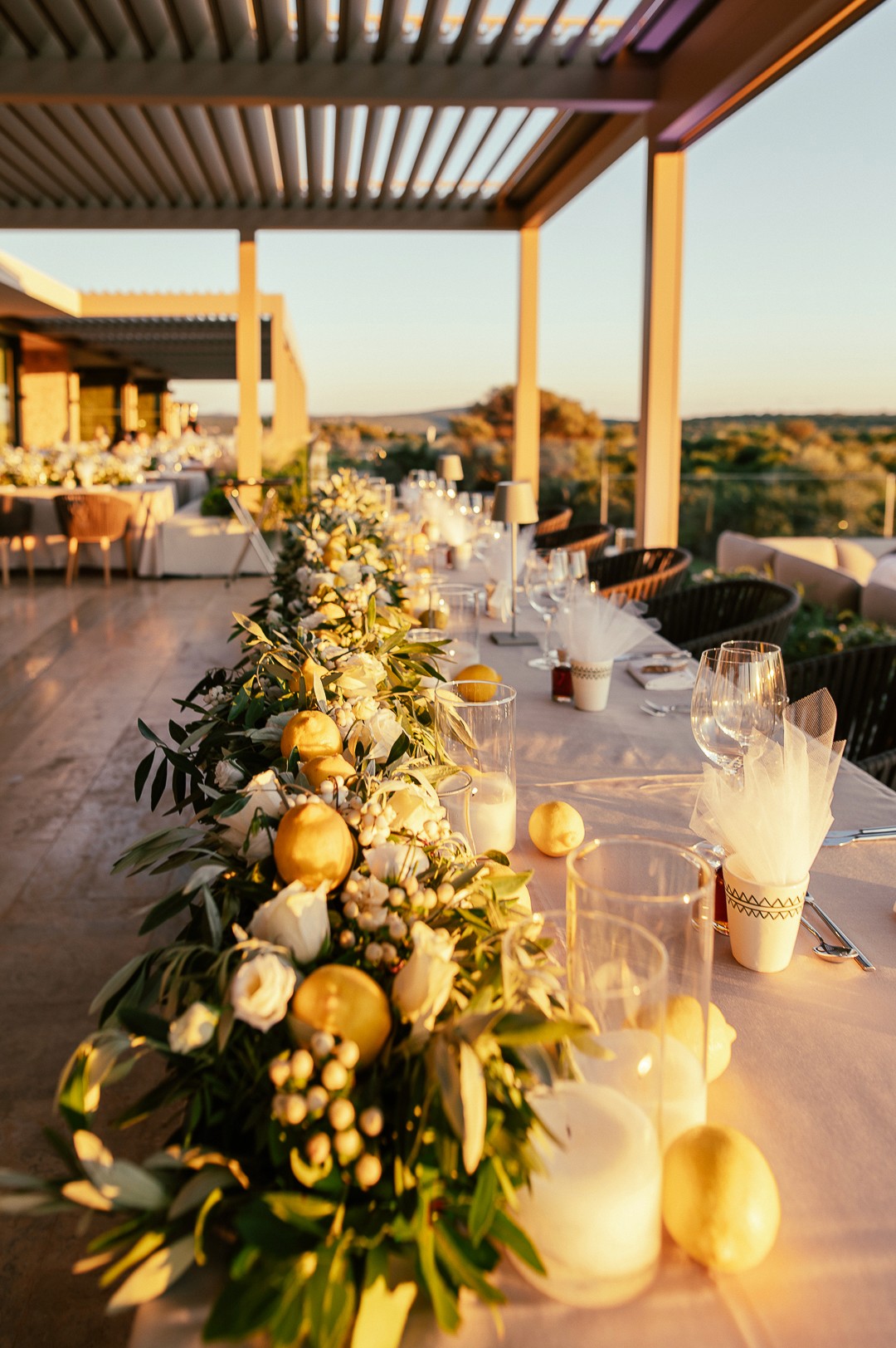 Close-up of a romantic beach wedding floral arch with white drapes by the sea in Messinia Greece
