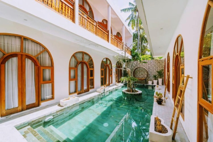 sunloungers fronting buildings near mountain