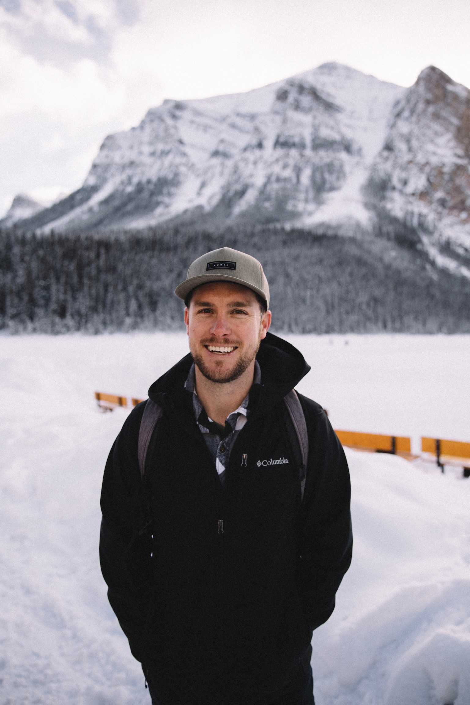 Jared Threw, House of Growth's founder, standing in front of Lake Louise, AB.