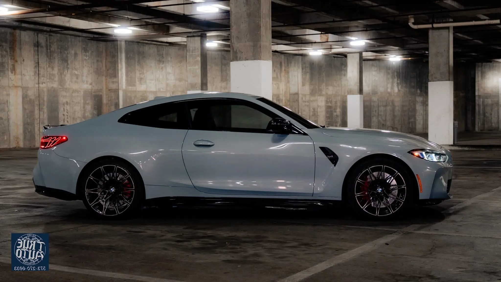 Grey car in a parking garage