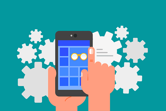 Illustration of hands holding smartphone with widgets in the background